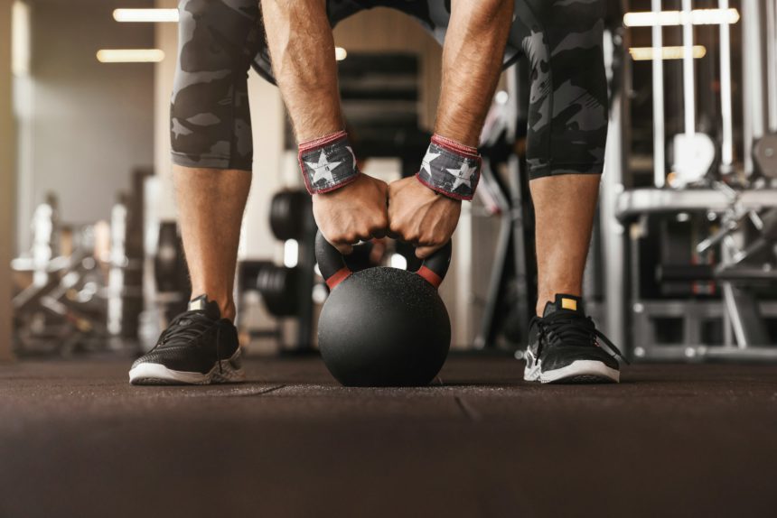 Close up photo of man strength workout training with dumbbells