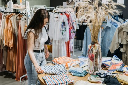 Fast fashion, Woman shopping in cloth store. shopping trendy clothes.