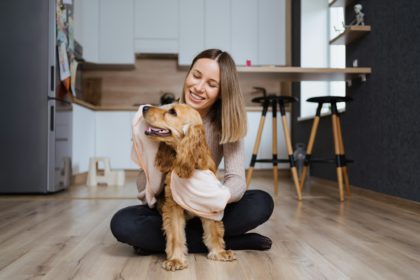 Pleasant photo about taking care and playing with a dog